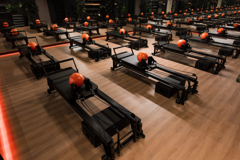 Black reformers with orange balls at Pure Motion Dubai