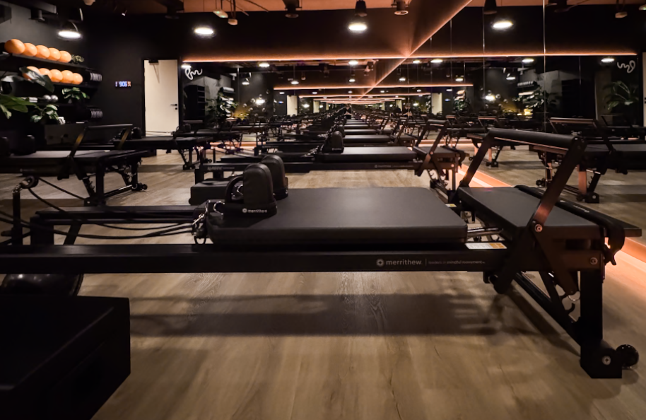 Modern reformer Pilates studio interior at Pure Motion